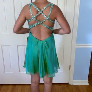 La femme dress. Green jeweled bust with open back.